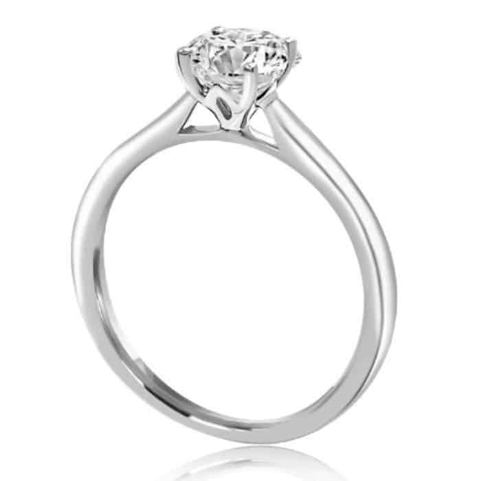 four claw solitaire engagement ring with lotus flower detail