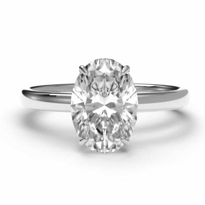 Oval cut hidden halo diamond engagement ring in platinum – birds eye view.jpg