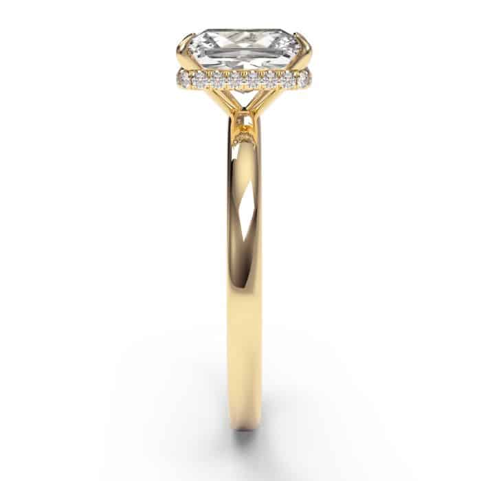 Oval cut hidden halo diamond engagement ring in yellow gold - side view