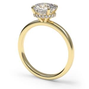 Round brilliant cut hidden halo diamond solitaire engagement ring in yellow gold