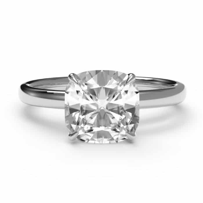 Birds eye view of a cushion cut diamond ring in a platinum gold band