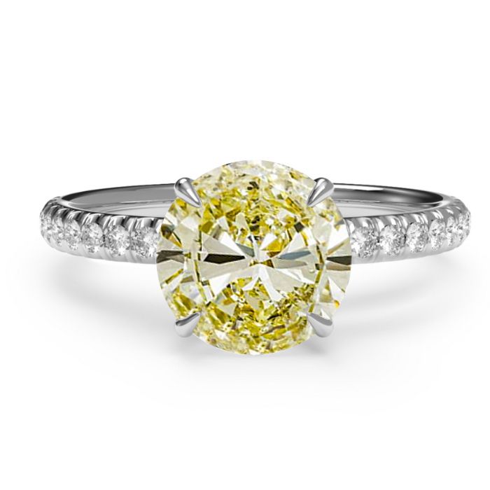 Intense Round yellow diamond in a platinum diamond band