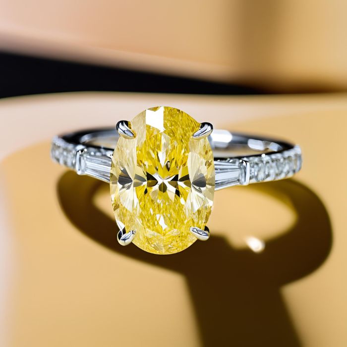 Oval yellow diamond engagement ring with baguettes